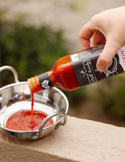 Pouring-Kickin-Hot-Sauce